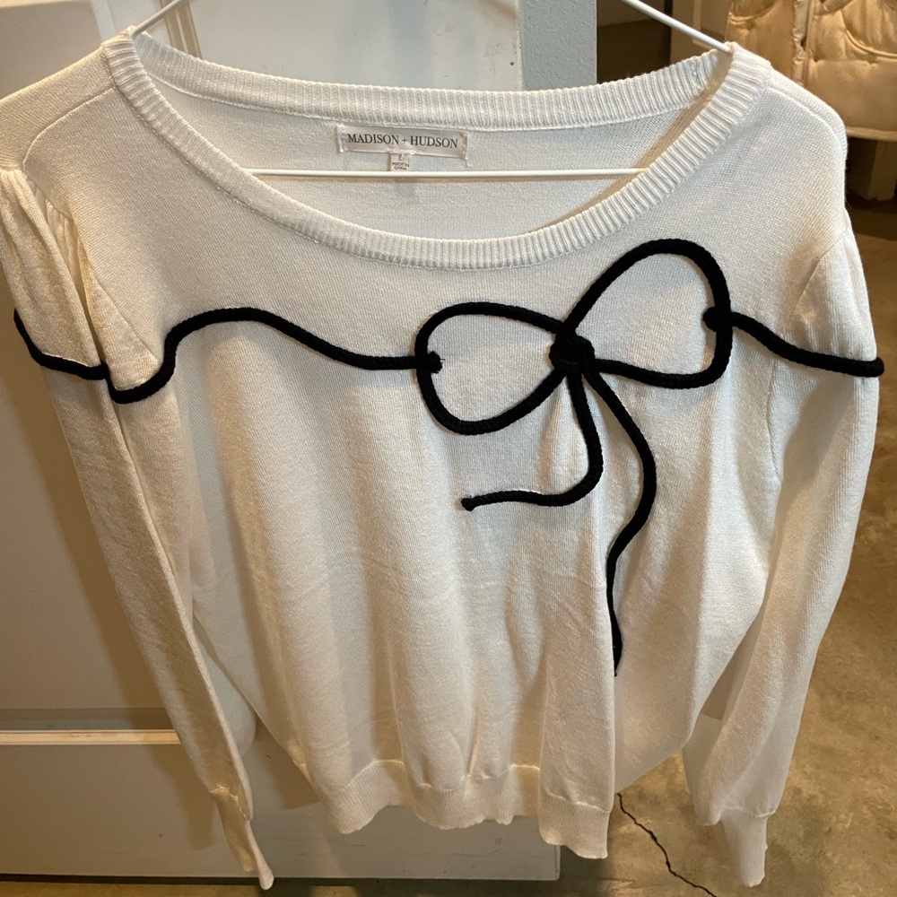 White Sweater with Black Bow Accent